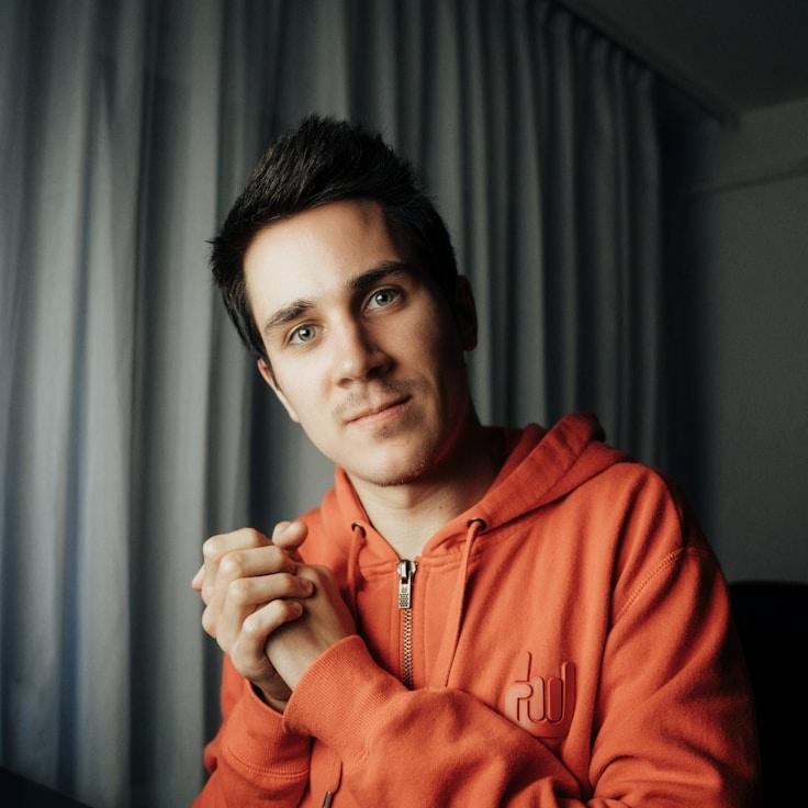 Alex Rivera, Lead Design Curator at Evening Valley Flow, reviewing corporate floral arrangements